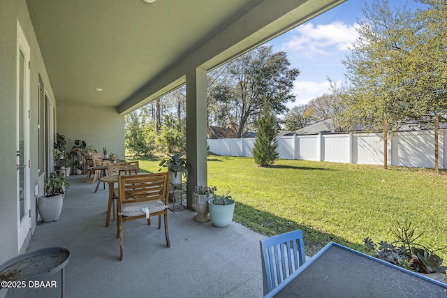 view of patio / terrace featuring fence