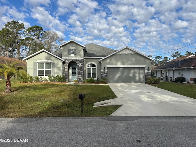 view of front of house with a garage and a front yard