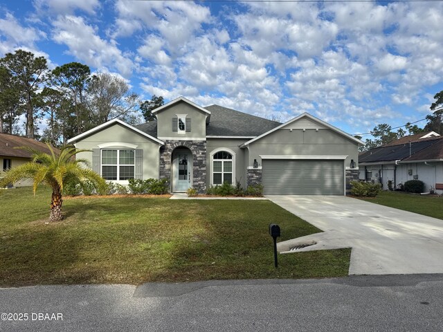 ranch-style house with stucco siding, a front yard, a garage, stone siding, and driveway