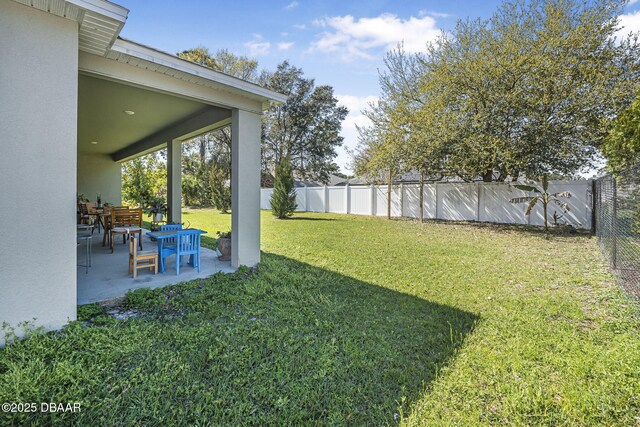 view of yard with a patio area and a fenced backyard