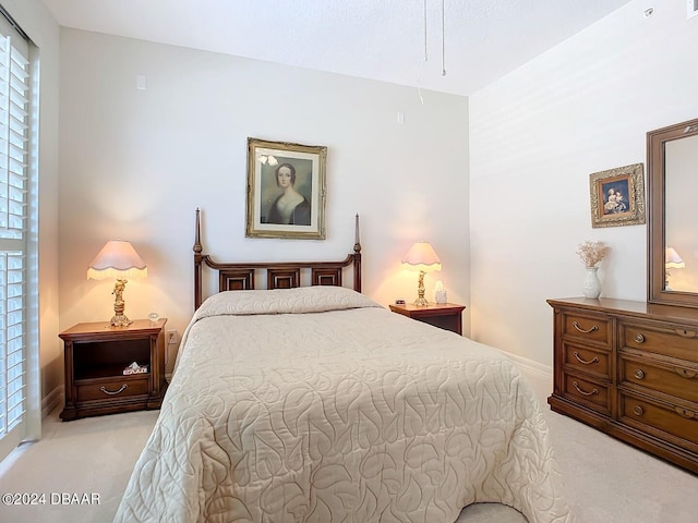 bedroom with light colored carpet