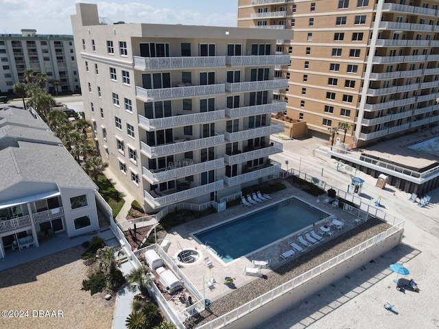 view of property featuring a community pool