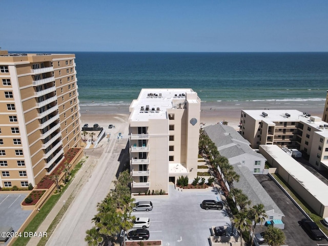 aerial view featuring a water view and a beach view