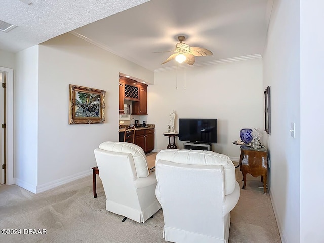 carpeted living room featuring a textured ceiling, ceiling fan, and crown molding