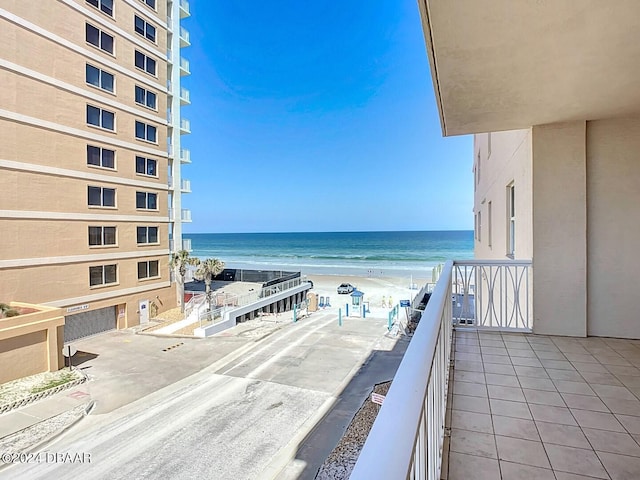 balcony with a view of the beach and a water view