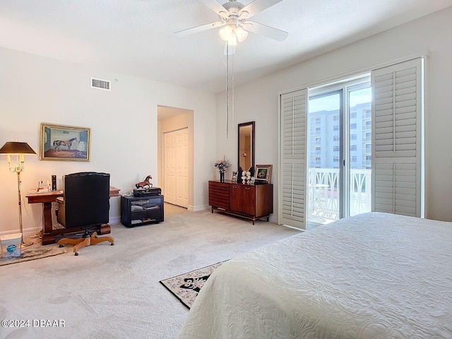 carpeted bedroom with access to outside, ceiling fan, and a closet