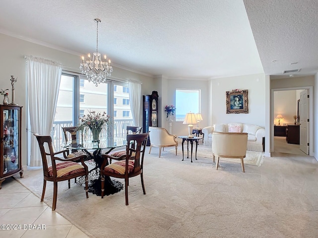 dining area featuring light tile patterned floors, visible vents, an inviting chandelier, ornamental molding, and a textured ceiling