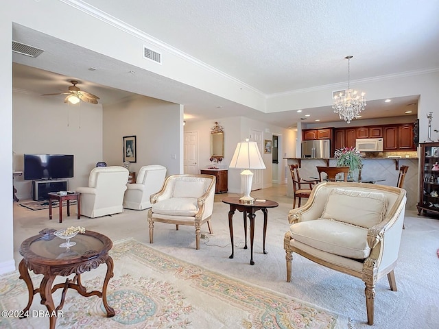 living area featuring light carpet, ornamental molding, a textured ceiling, and visible vents