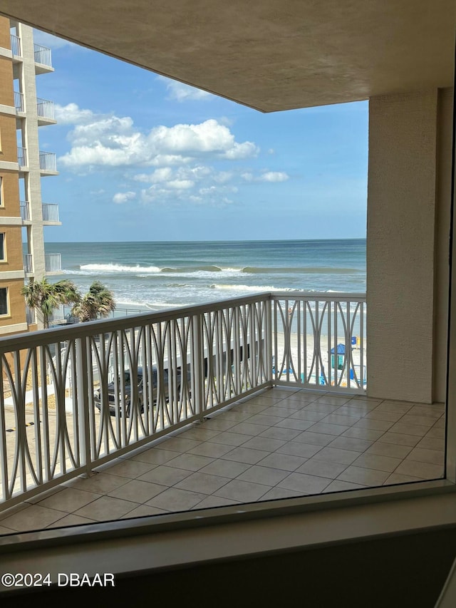 balcony with a view of the beach and a water view