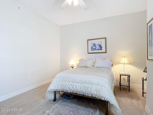 bedroom featuring ceiling fan and light carpet