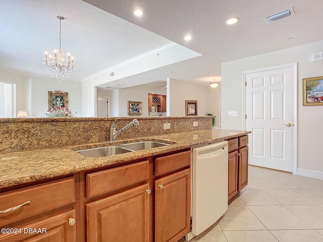 kitchen with light tile patterned floors, a sink, visible vents, light stone countertops, and dishwasher