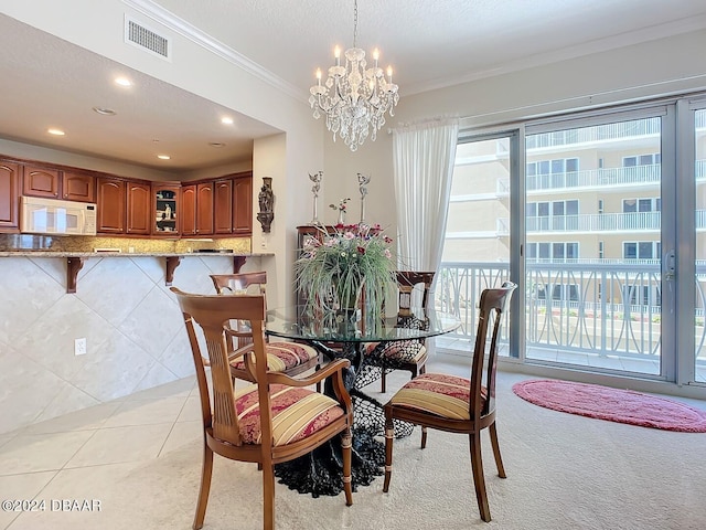 dining area featuring light tile patterned floors, visible vents, crown molding, a textured ceiling, and a notable chandelier