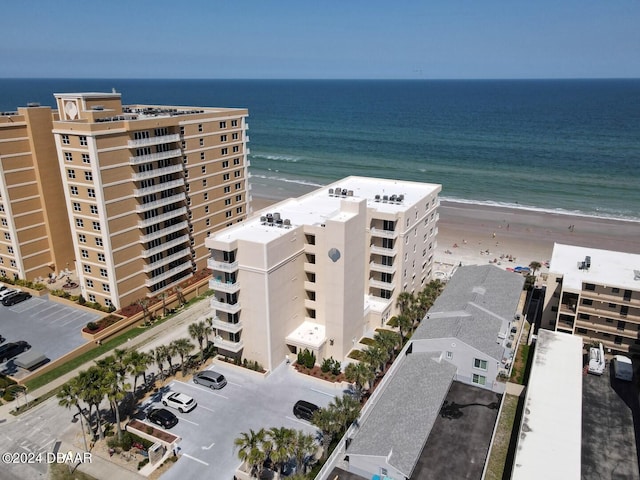 bird's eye view featuring a water view and a view of the beach