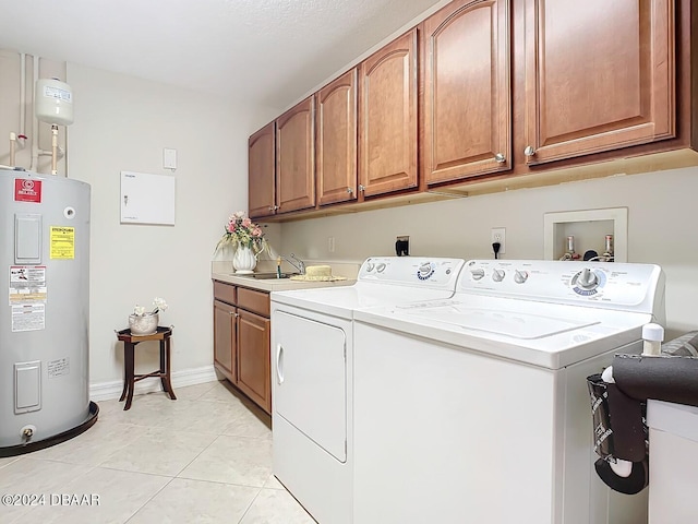 laundry room with separate washer and dryer, light tile patterned floors, cabinets, sink, and electric water heater