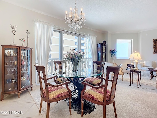 dining room with ornamental molding, plenty of natural light, a textured ceiling, and light tile patterned floors