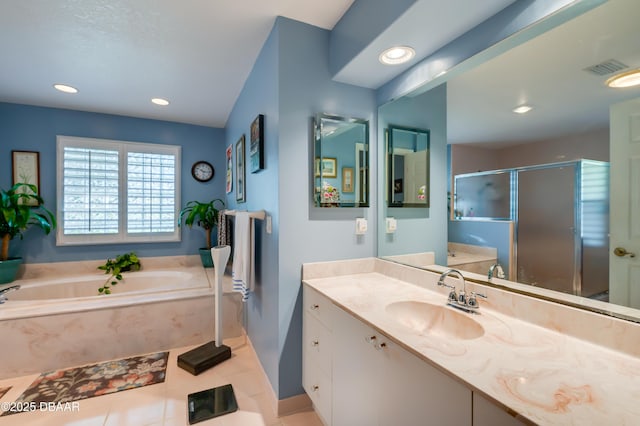 bathroom featuring vanity, tile patterned floors, and plus walk in shower