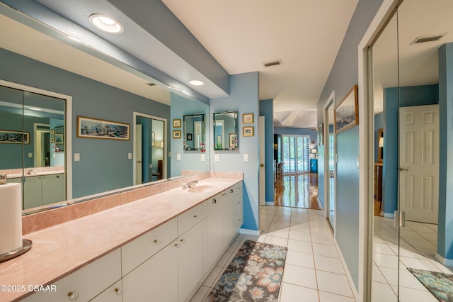 bathroom with vanity and tile patterned floors