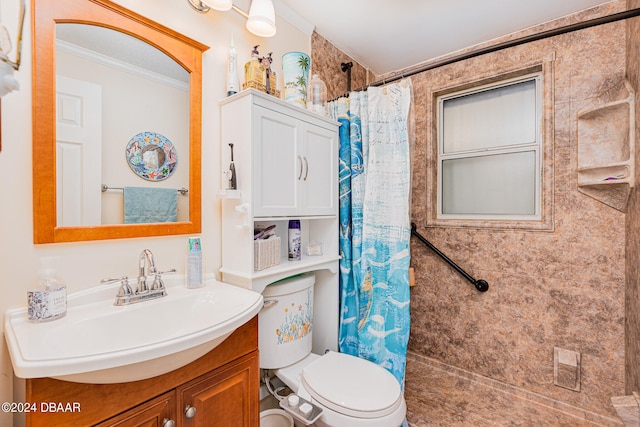 bathroom featuring toilet, vanity, curtained shower, and crown molding