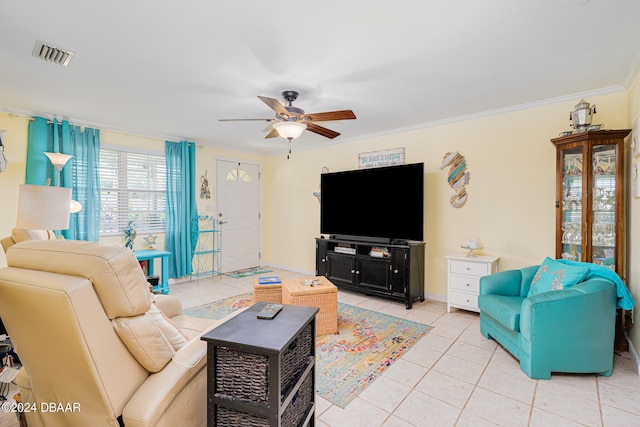 living room featuring light tile patterned flooring, ceiling fan, and ornamental molding