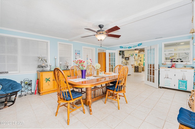 dining room with ceiling fan, light tile patterned floors, french doors, and ornamental molding