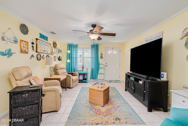 living room featuring ceiling fan, light tile patterned floors, and ornamental molding