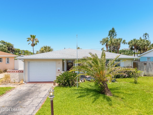 single story home featuring a front lawn and a garage