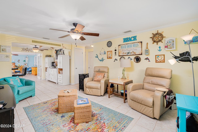 tiled living room featuring ceiling fan and crown molding