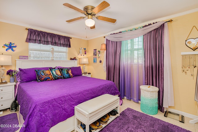 tiled bedroom with ceiling fan and crown molding