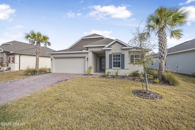 view of front facade featuring a garage and a front yard