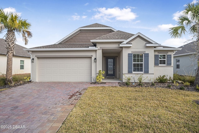 view of front of property featuring a garage and a front yard