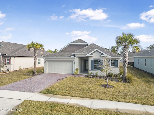 view of front of house featuring a garage and a front yard