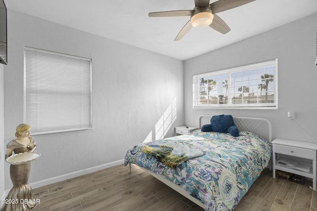 bedroom featuring ceiling fan and hardwood / wood-style floors