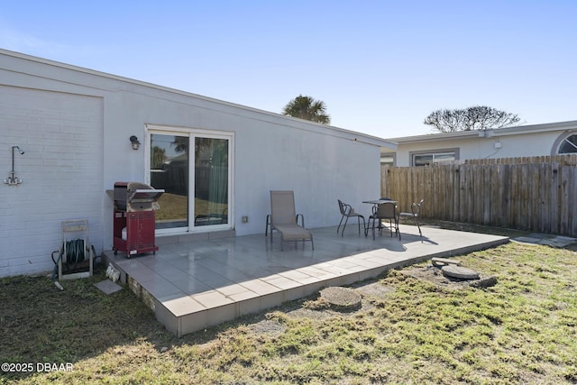 back of property featuring a patio