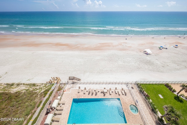 bird's eye view with a view of the beach and a water view