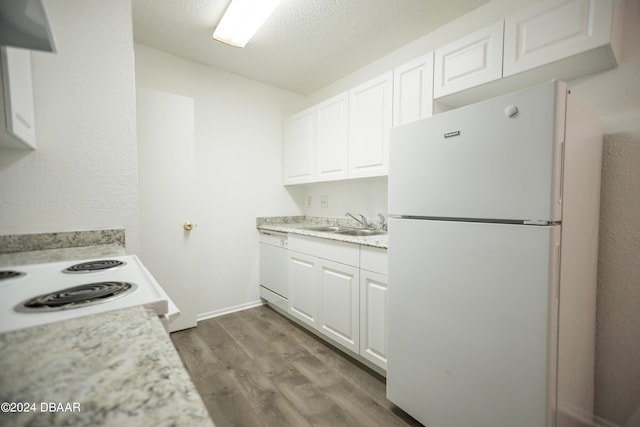 kitchen with white cabinetry, a textured ceiling, sink, dark wood-type flooring, and white appliances