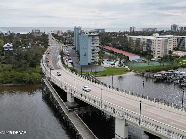 birds eye view of property featuring a water view and a city view