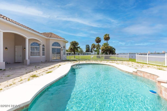 view of swimming pool with a patio