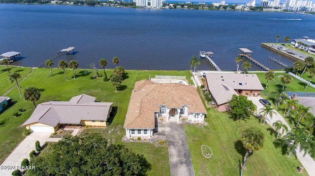 birds eye view of property with a water view