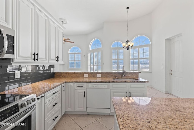 kitchen with white cabinets, stainless steel appliances, and sink