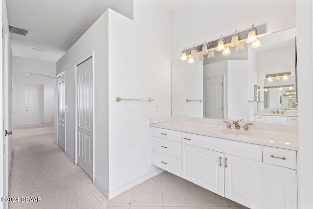 bathroom with tile patterned flooring and vanity