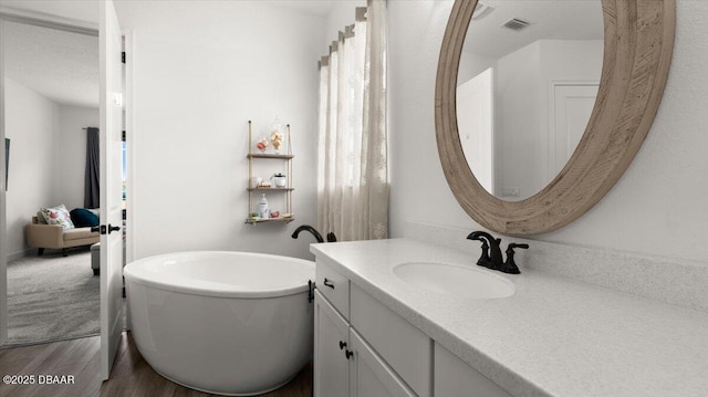 bathroom featuring vanity and hardwood / wood-style floors