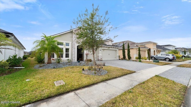 view of front of home featuring a garage and a front yard