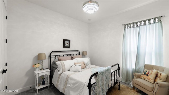 bedroom featuring carpet floors and multiple windows