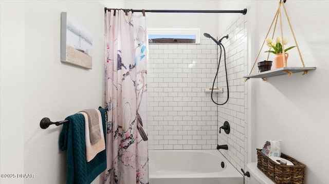 bathroom with shower / bath combo with shower curtain