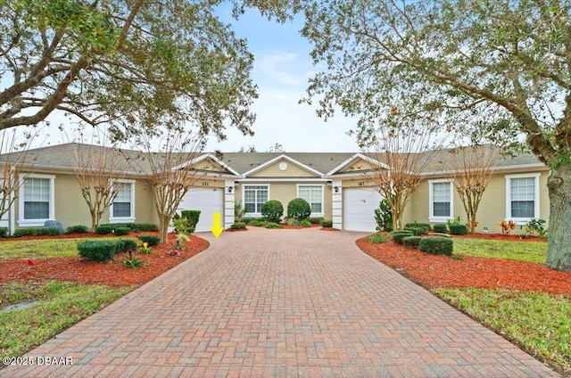 ranch-style house featuring a garage