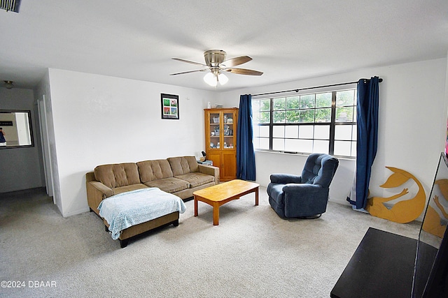 carpeted living area with ceiling fan, a textured ceiling, and visible vents