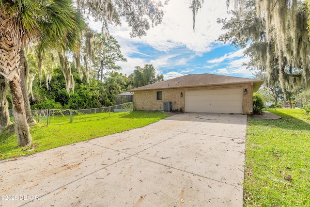 view of side of property with cooling unit, a garage, and a lawn