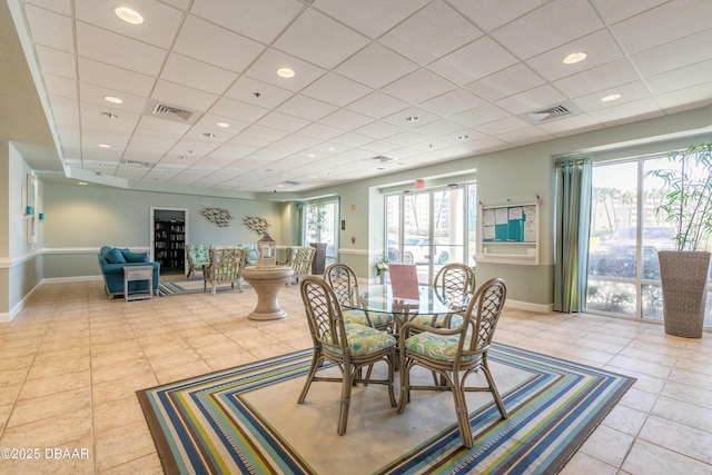 tiled dining space with baseboards, recessed lighting, visible vents, and a paneled ceiling