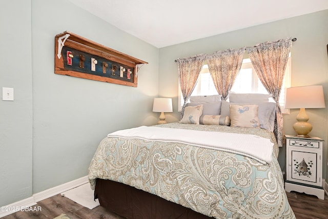 530 Ronnoc Ln, New Smyrna Beach, FL 32168 - bedroom with baseboards and wood finished floors
