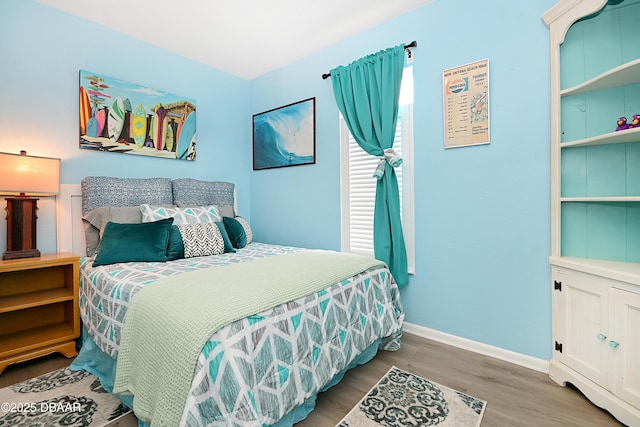 530 Ronnoc Ln, New Smyrna Beach, FL 32168 - bedroom with wood finished floors and baseboards